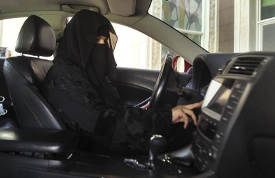 A woman drives a car in Saudi Arabia